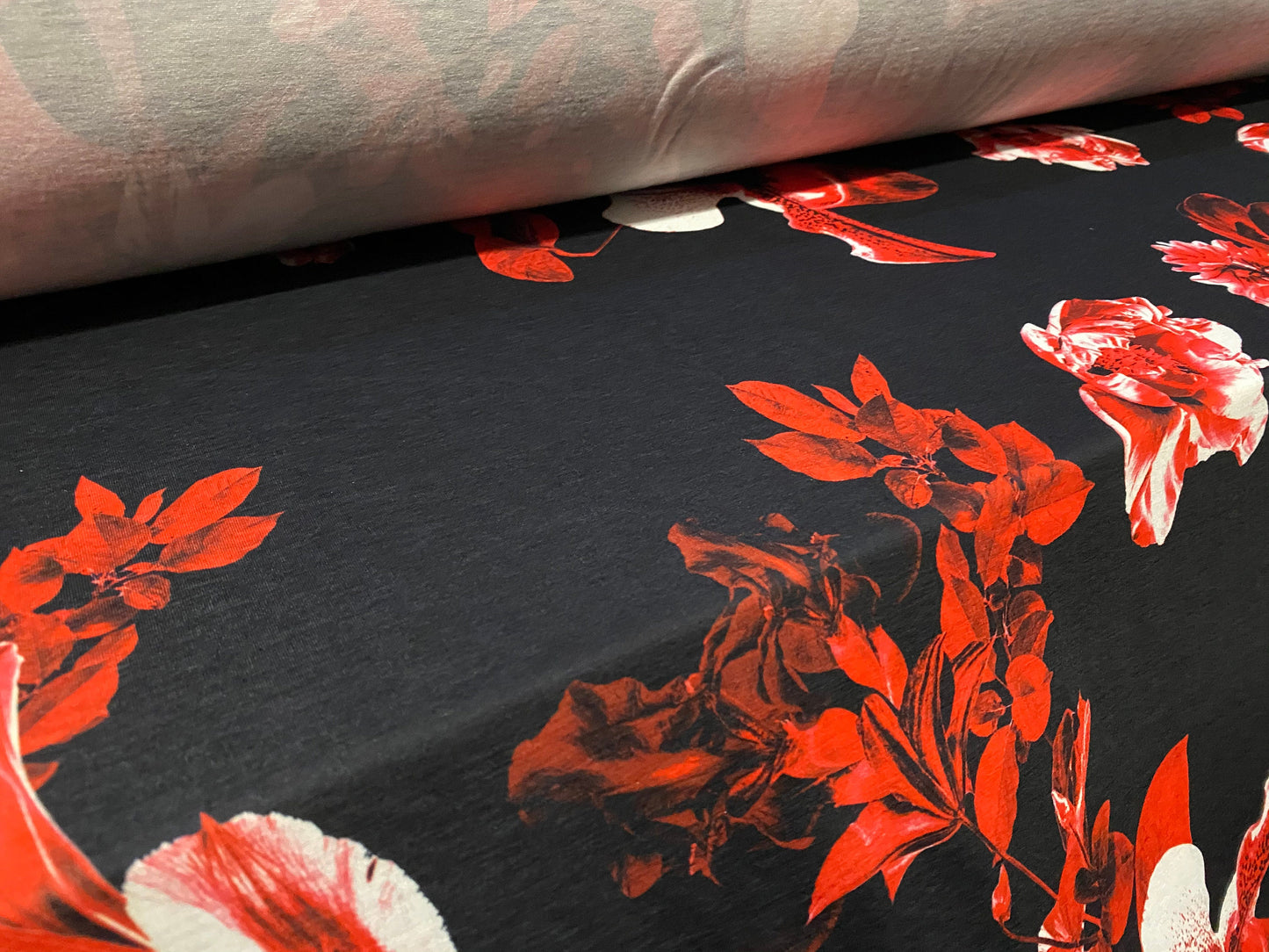 Soft handle jersey fabric, per metre - black with red orchid print