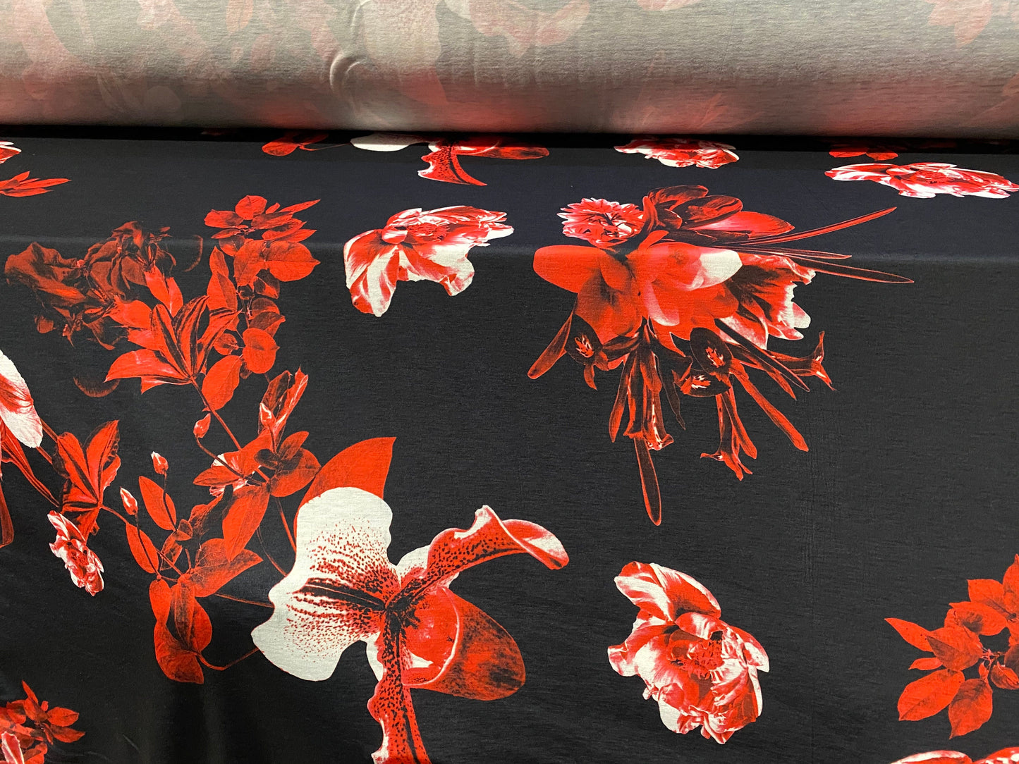 Soft handle jersey fabric, per metre - black with red orchid print