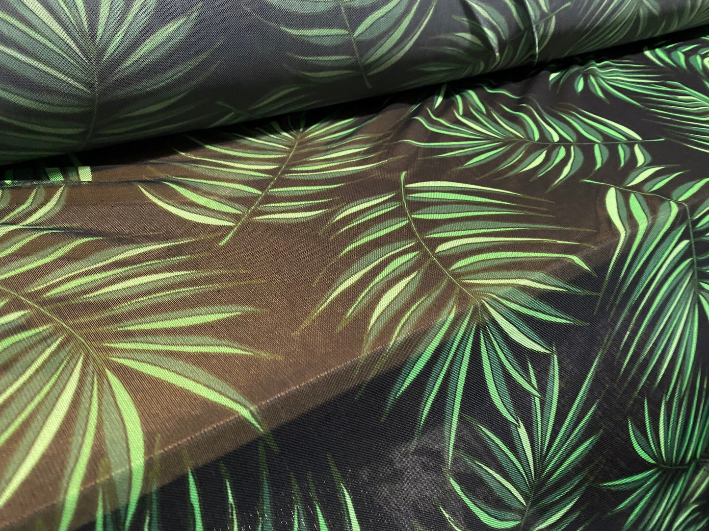 Power mesh net stretch fabric, per metre - black with green leaf print