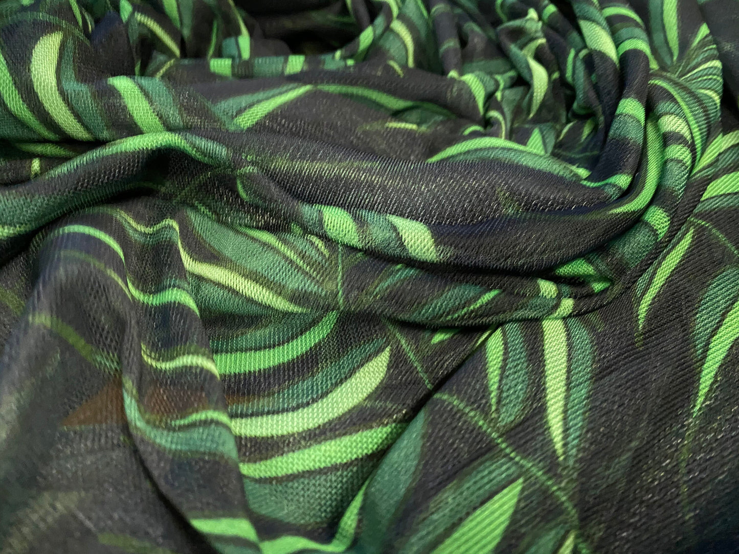 Power mesh net stretch fabric, per metre - black with green leaf print