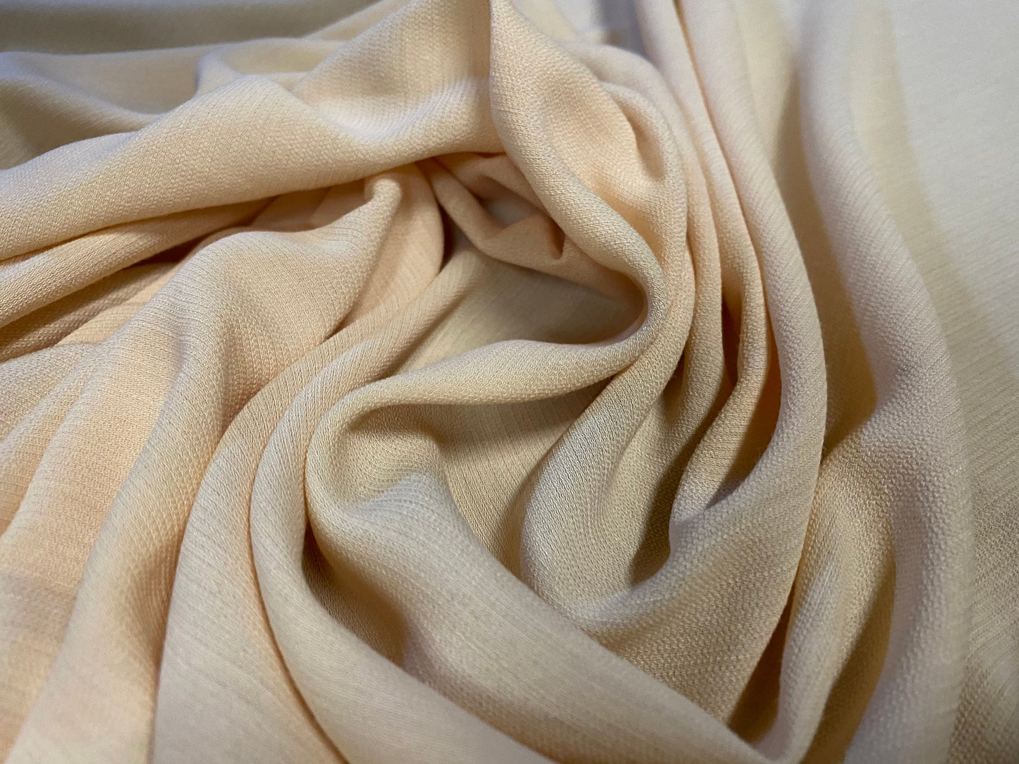 Textured seersucker style woven dress fabric, per metre - light peach