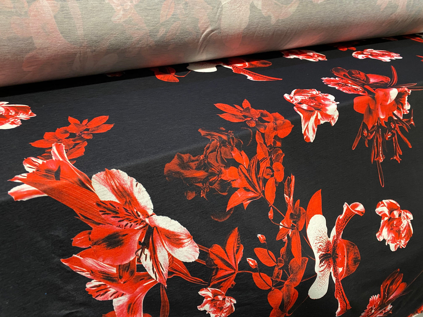 Soft handle jersey fabric, per metre - black with red orchid print