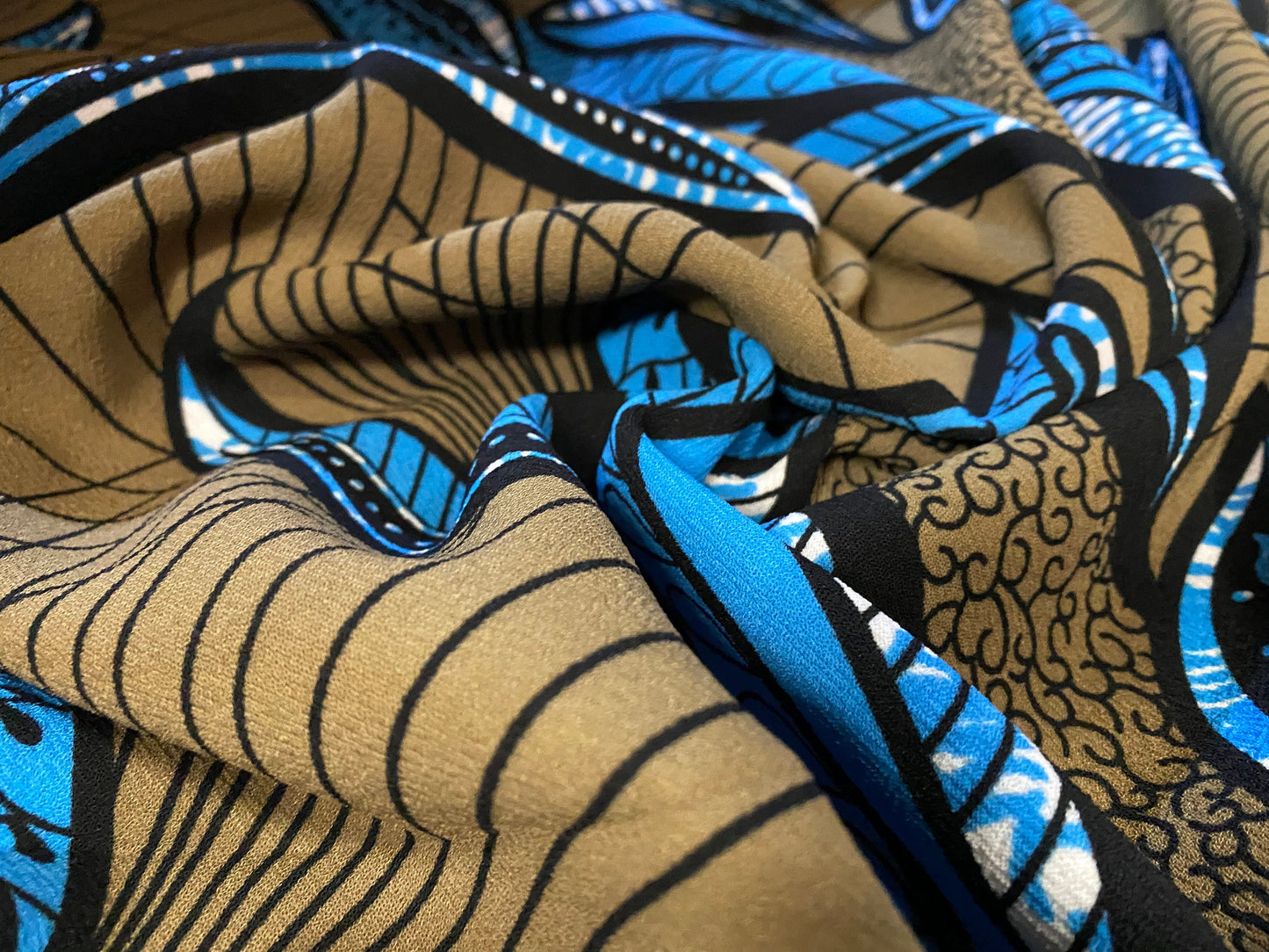 Heavyweight moss crepe woven dress fabric with comfort stretch - large leaf print - light bronze & blue