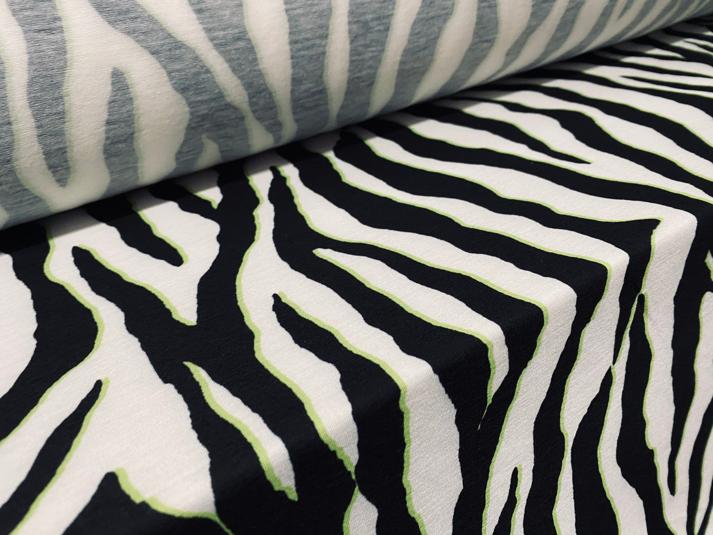 Soft handle jersey dress  fabric, per metre - black white & yellow zebra print