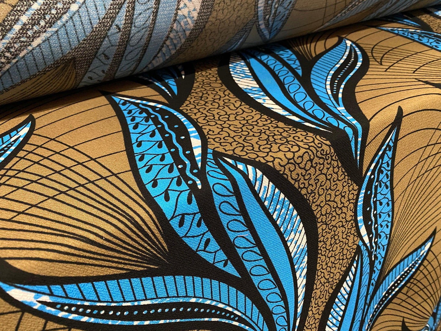 Heavyweight moss crepe woven dress fabric with comfort stretch - large leaf print - light bronze & blue