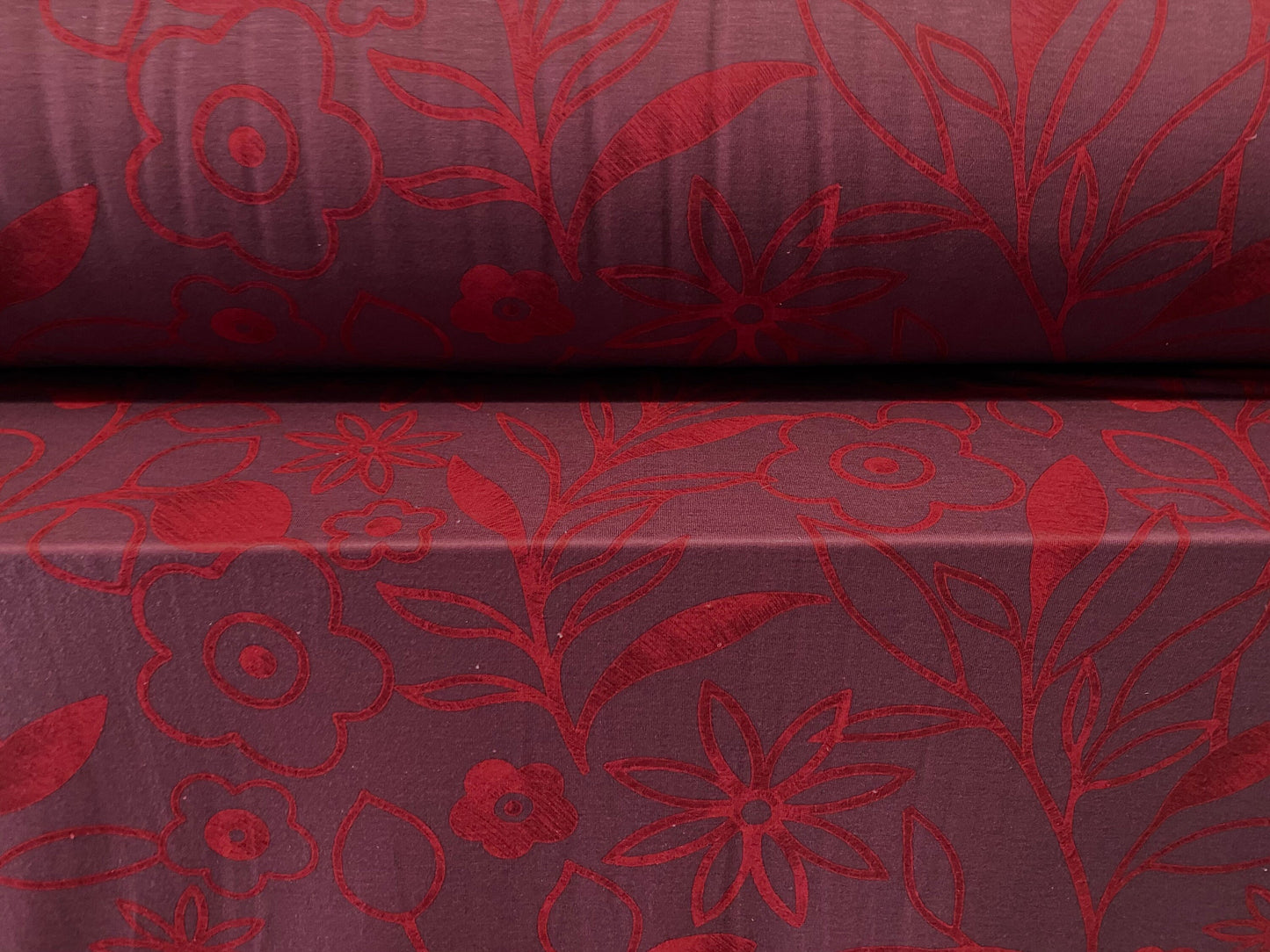 Soft handle jersey dress  fabric, per metre - dark aubergine with red flower print
