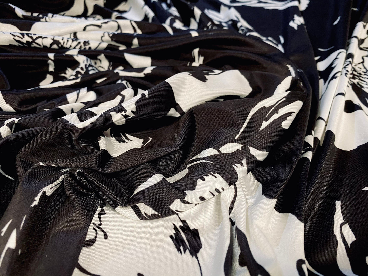 Soft touch stretch spandex jersey fabric, per metre - black with white floral print