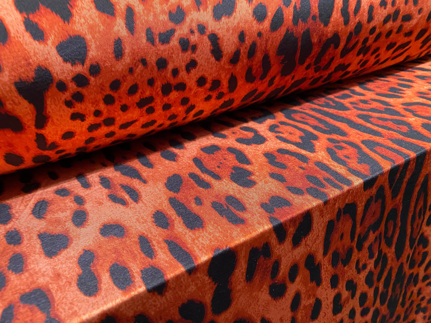 Disco shimmer stretch spandex jersey fabric, per metre - Red leopardskin print