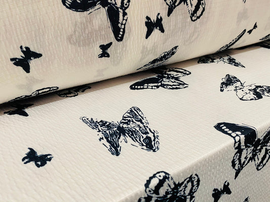 Textured lightweight single jersey dress fabric, per metre - white with black butterfly print - monochrome