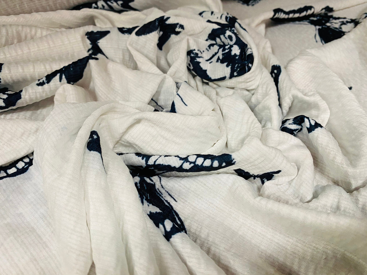 Textured lightweight single jersey dress fabric, per metre - white with black butterfly print - monochrome