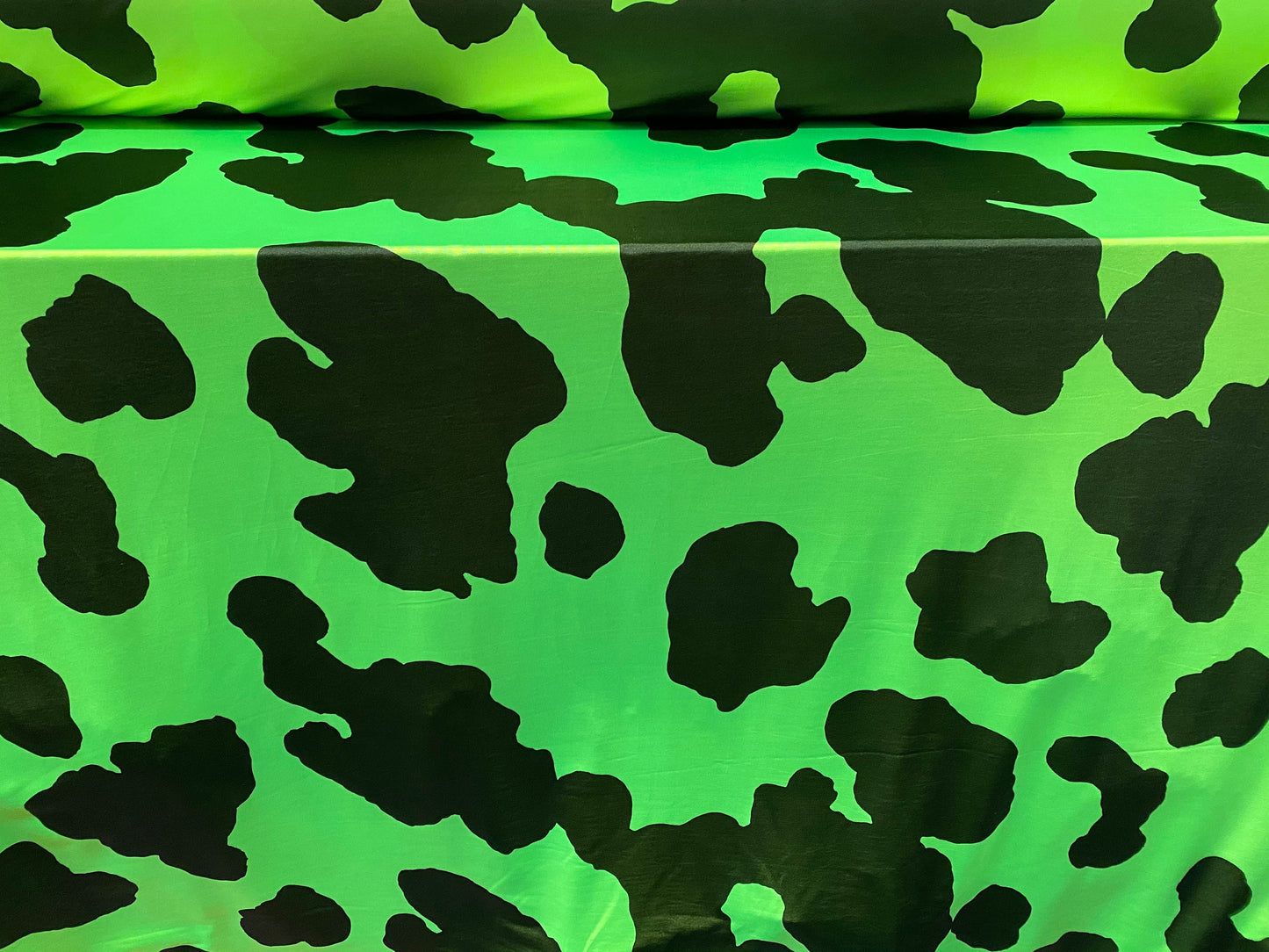 Disco shimmer stretch spandex jersey fabric, per metre - cow hide print - green