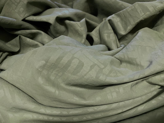Woven powder touch dress fabric, per metre - khaki geometric print