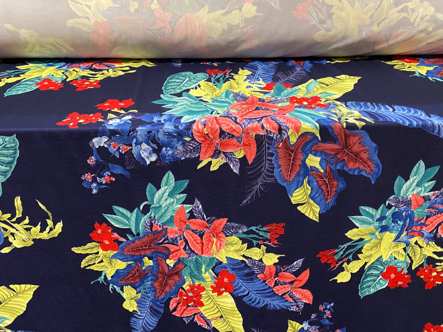 Soft touch stretch spandex jersey fabric, per metre - navy with leaf bouquet print