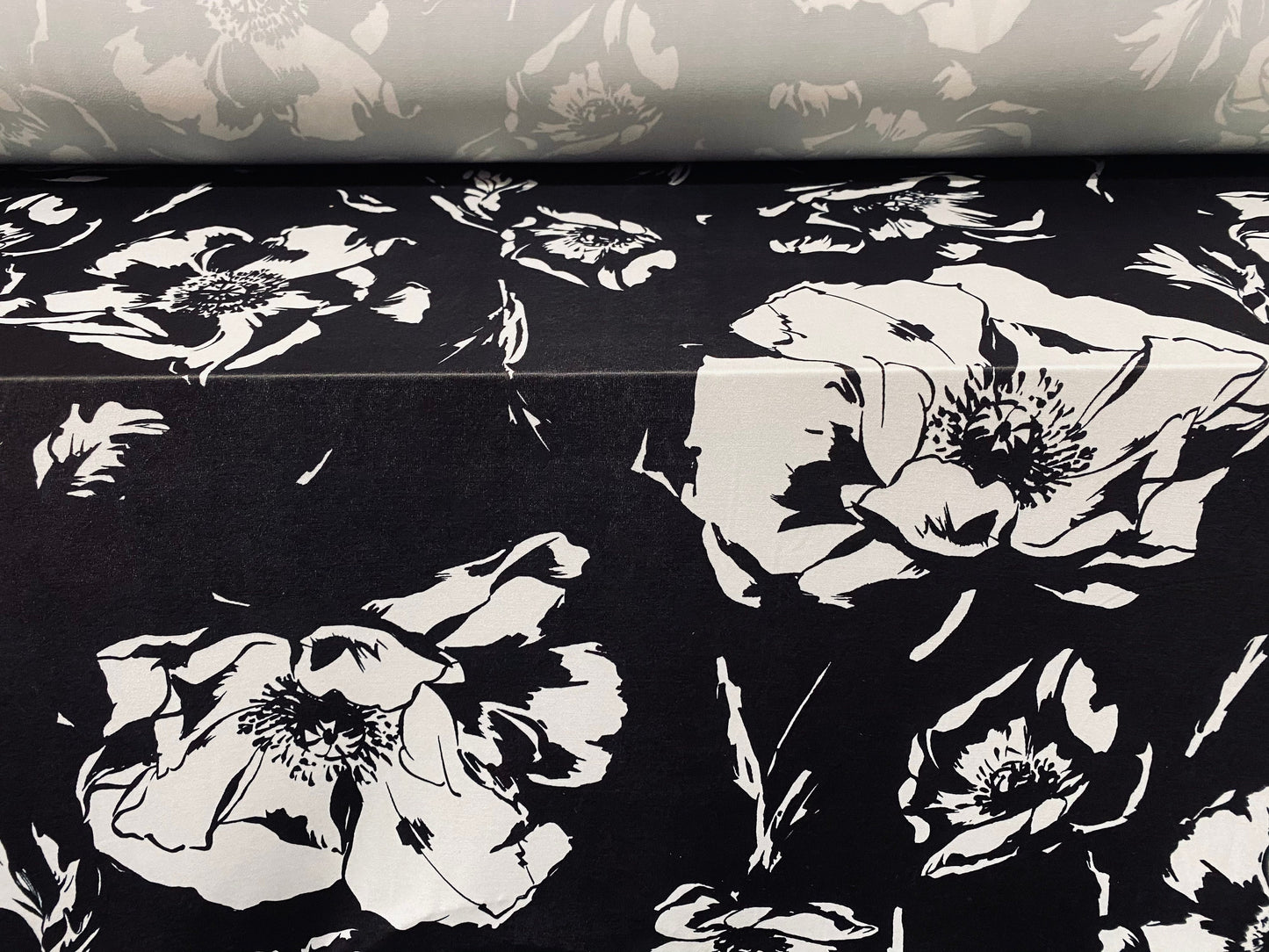 Soft touch stretch spandex jersey fabric, per metre - black with white floral print