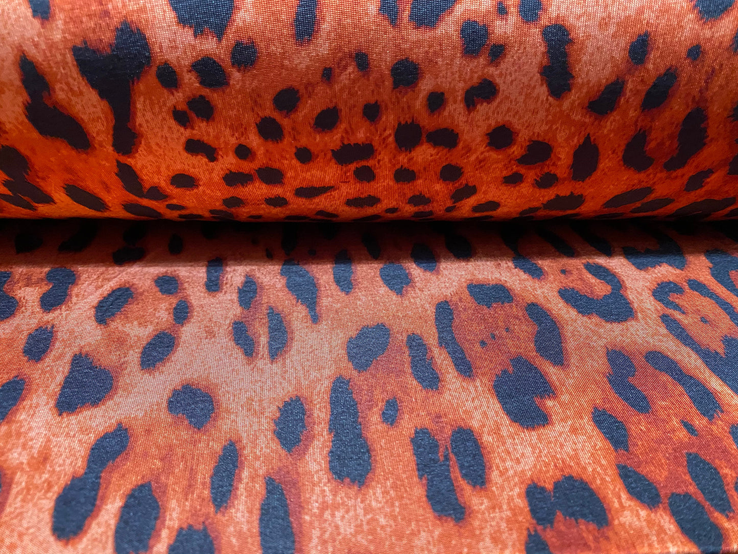 Disco shimmer stretch spandex jersey fabric, per metre - Red leopardskin print