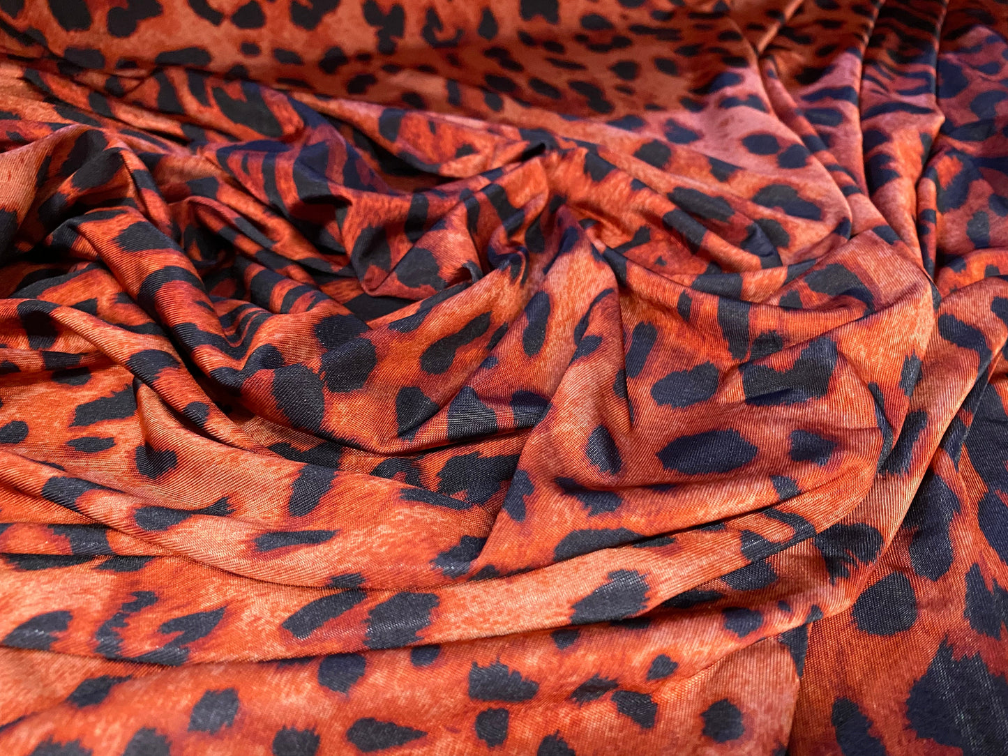 Disco shimmer stretch spandex jersey fabric, per metre - Red leopardskin print