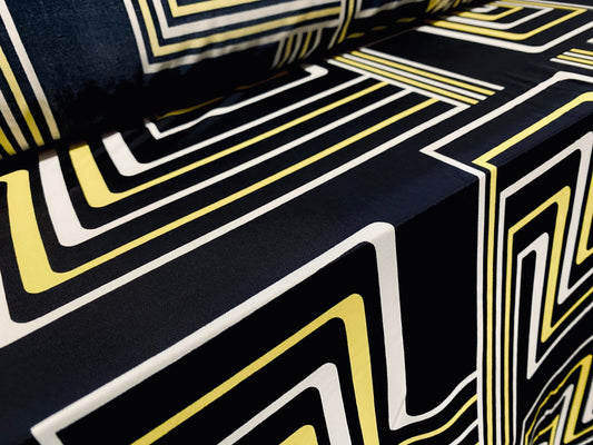 Spandex stretch ITY jersey fabric, per metre - black with black & yellow retro geometric print