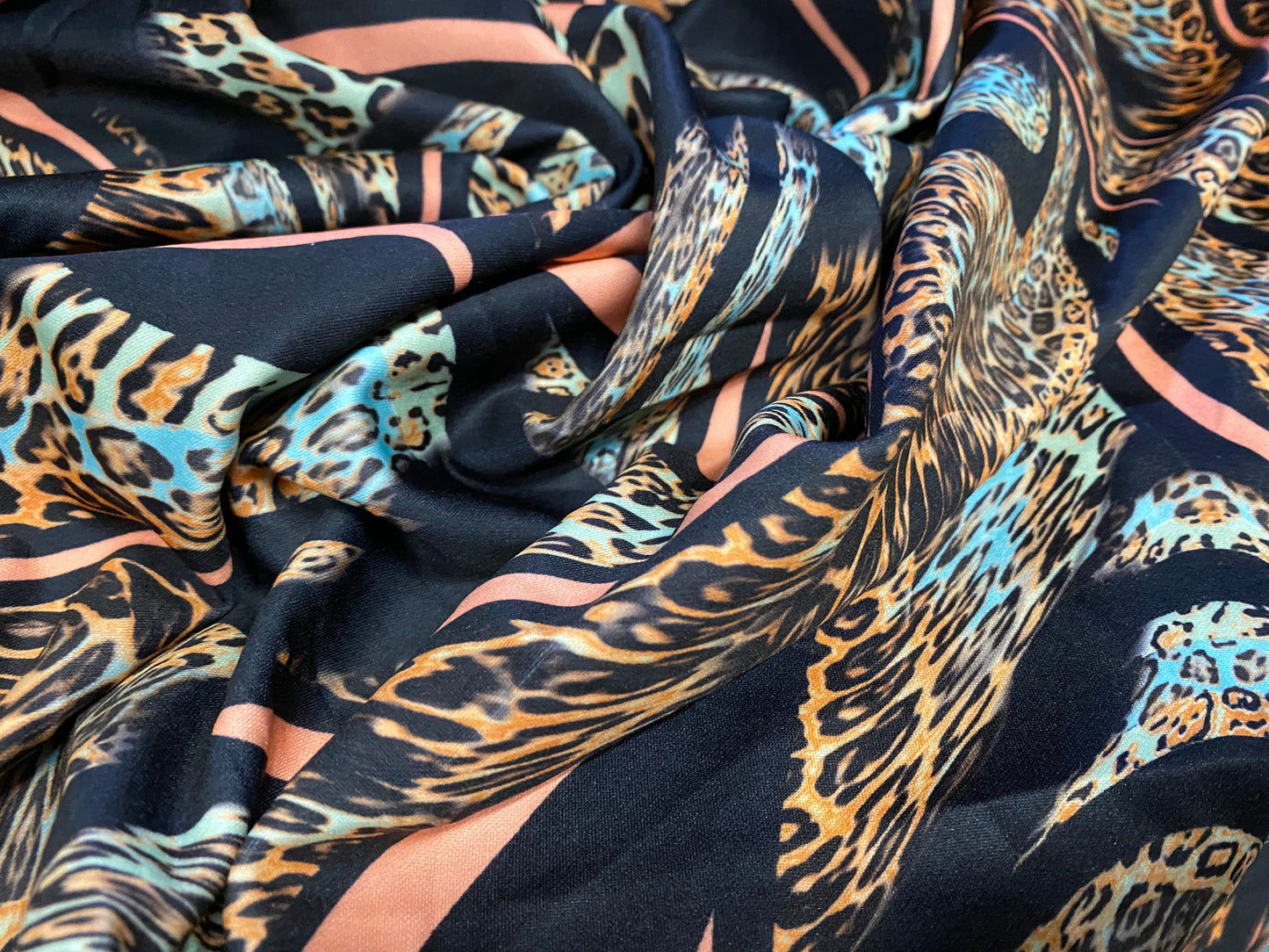 Scuba neoprene style double jersey stretch fabric, per metre -  Leopardskin swirl print - coral & black