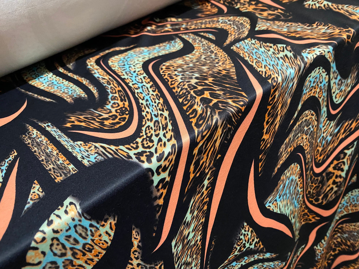 Scuba neoprene style double jersey stretch fabric, per metre -  Leopardskin swirl print - coral & black