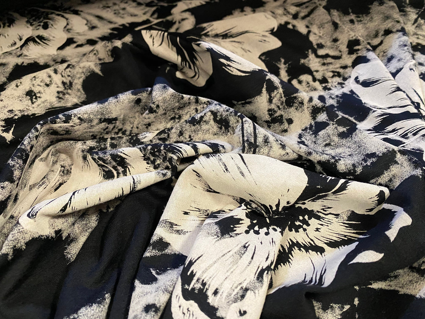 Viscose Elastane stretch jersey fabric, per metre - black with stone flowers and tie dye print