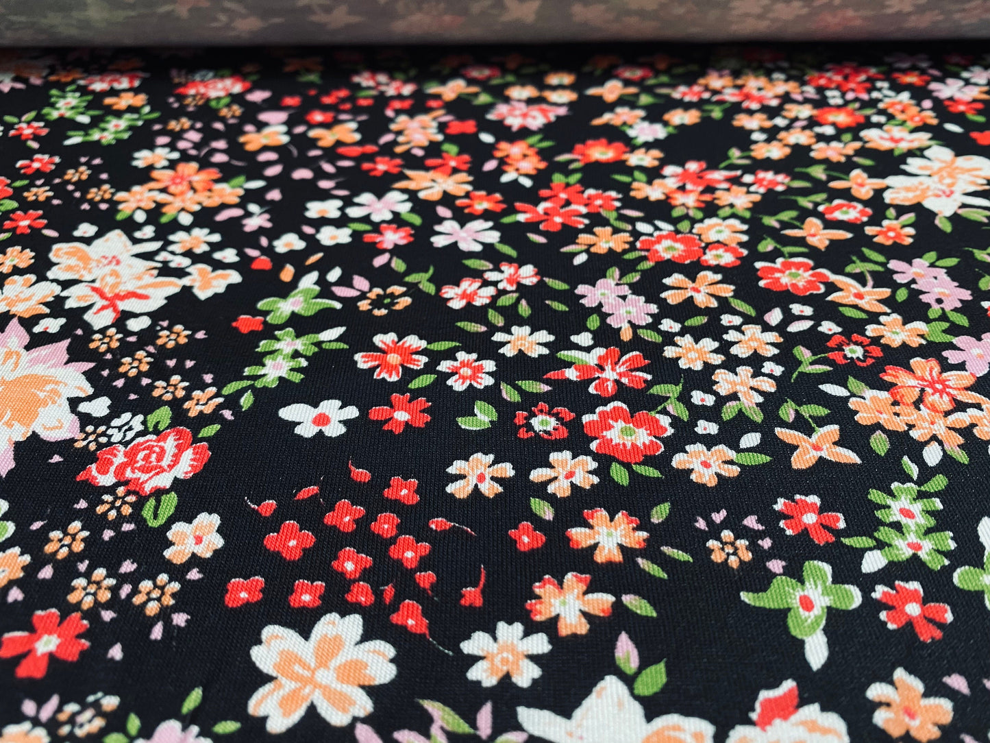 Viscose Elastane stretch jersey fabric, per metre - black with multicolour small flowers print