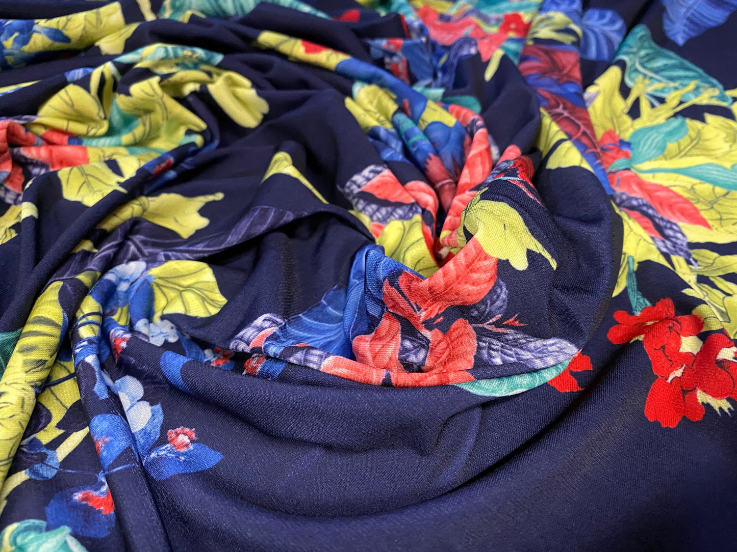 Soft touch stretch spandex jersey fabric, per metre - navy with leaf bouquet print