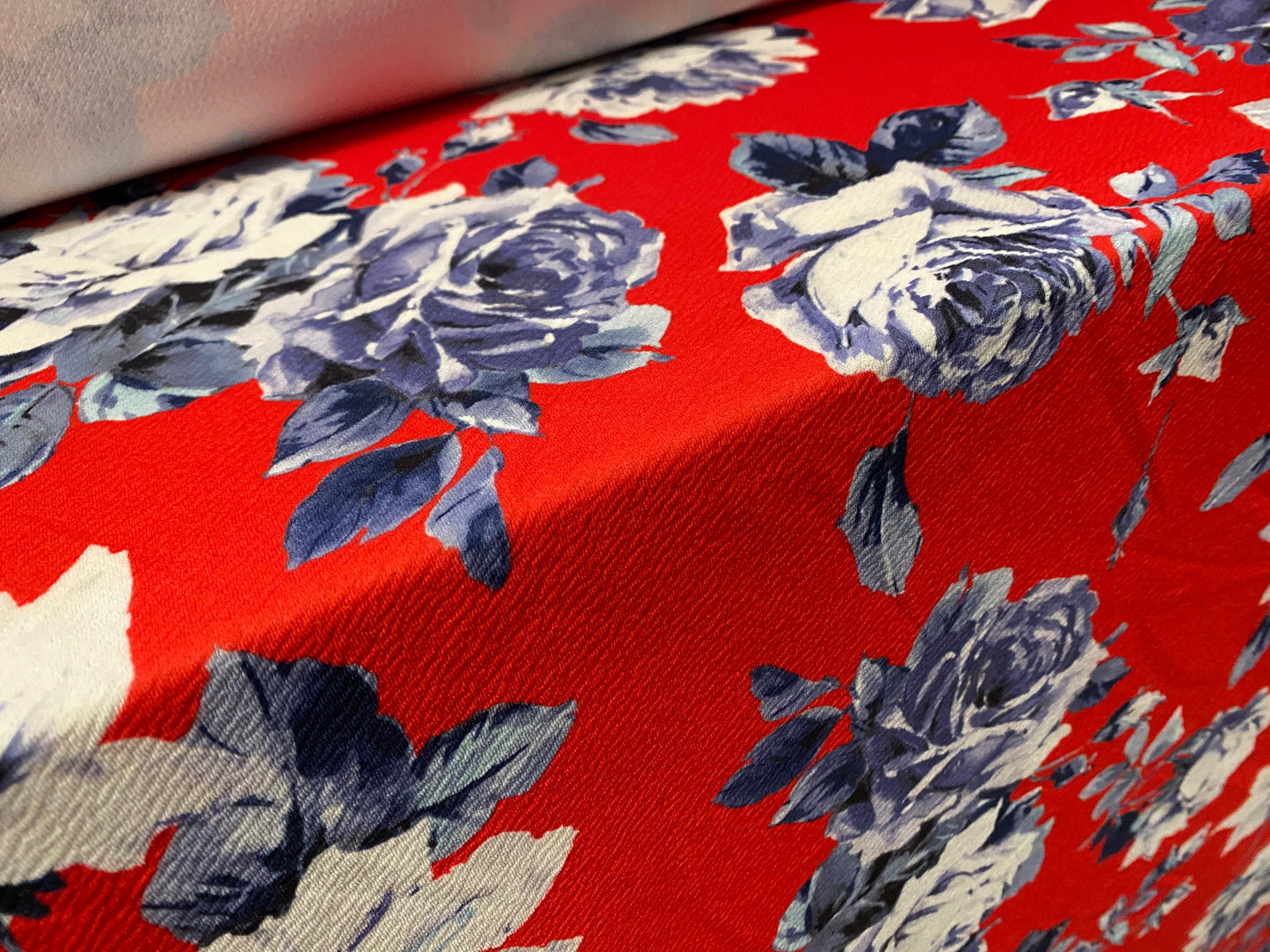 Scuba textured ‘Liverpool’ stretch spandex jersey fabric, per metre - Red with blue rose print