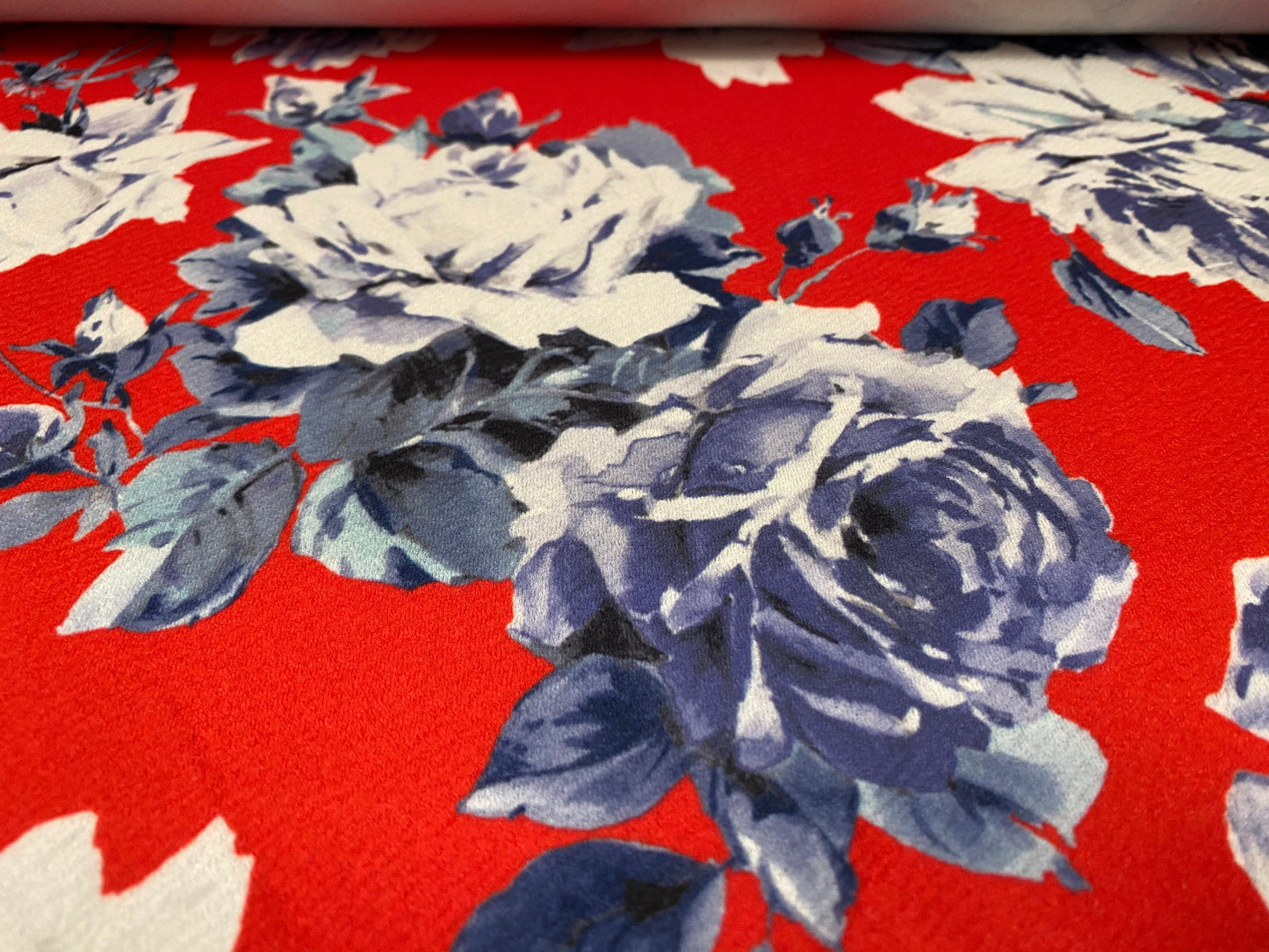 Scuba textured ‘Liverpool’ stretch spandex jersey fabric, per metre - Red with blue rose print