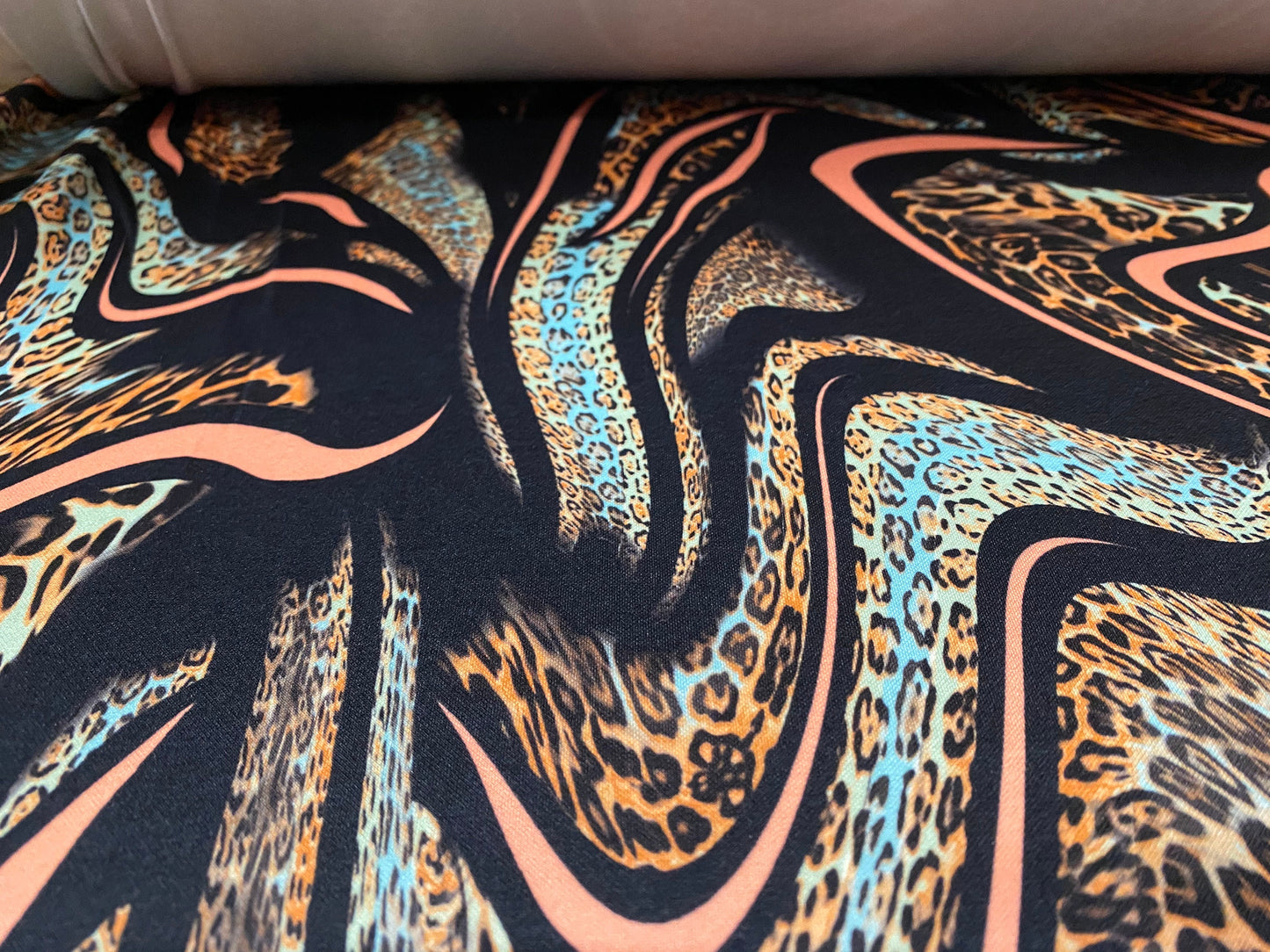 Scuba neoprene style double jersey stretch fabric, per metre -  Leopardskin swirl print - coral & black