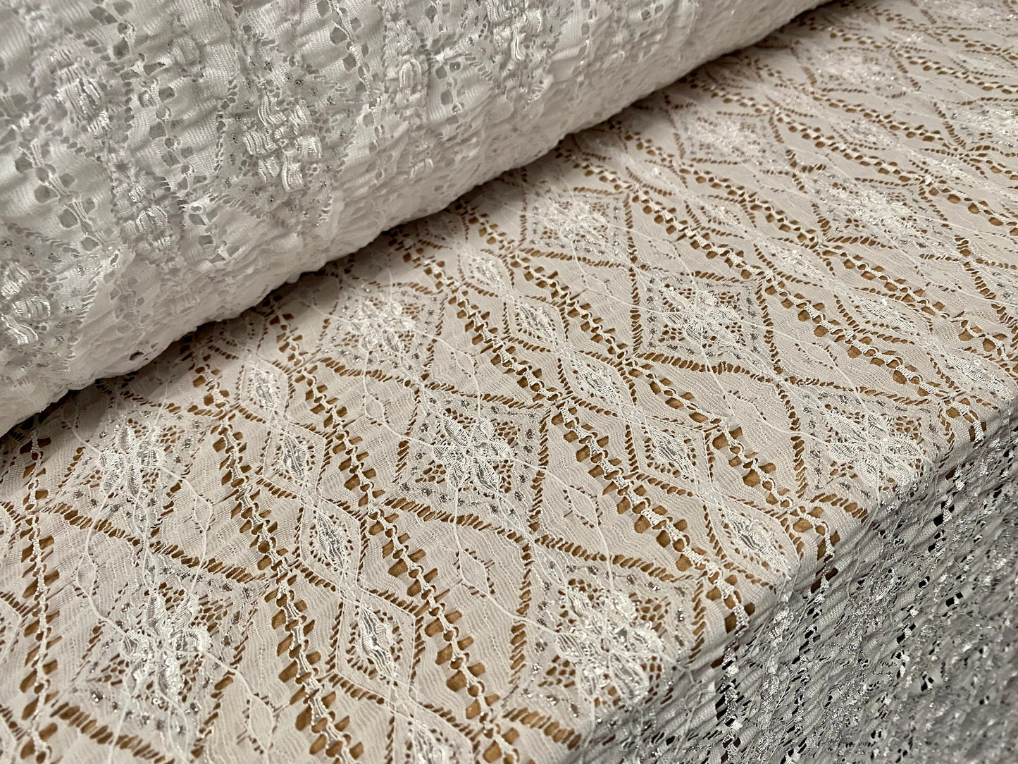 Ruched Aztec Inca design stretch lace fabric with lurex, per metre - white & silver