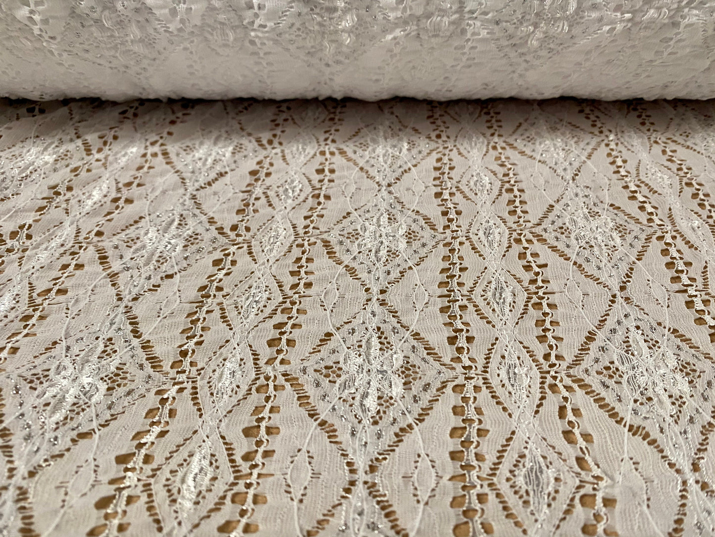 Ruched Aztec Inca design stretch lace fabric with lurex, per metre - white & silver