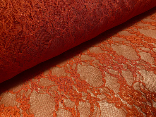 Floral stretch lace net fabric, per metre - burnt orange