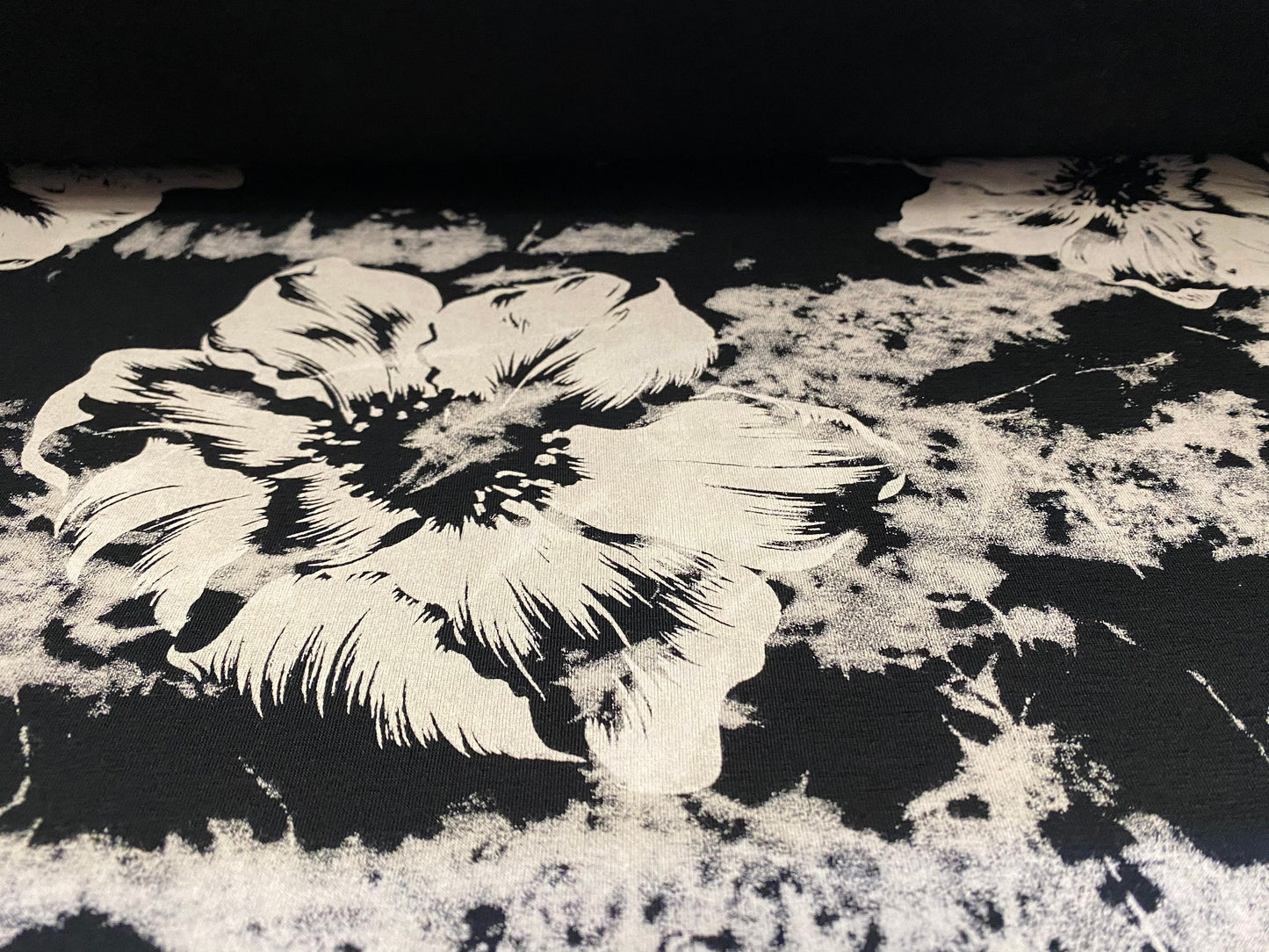 Viscose Elastane stretch jersey fabric, per metre - black with stone flowers and tie dye print