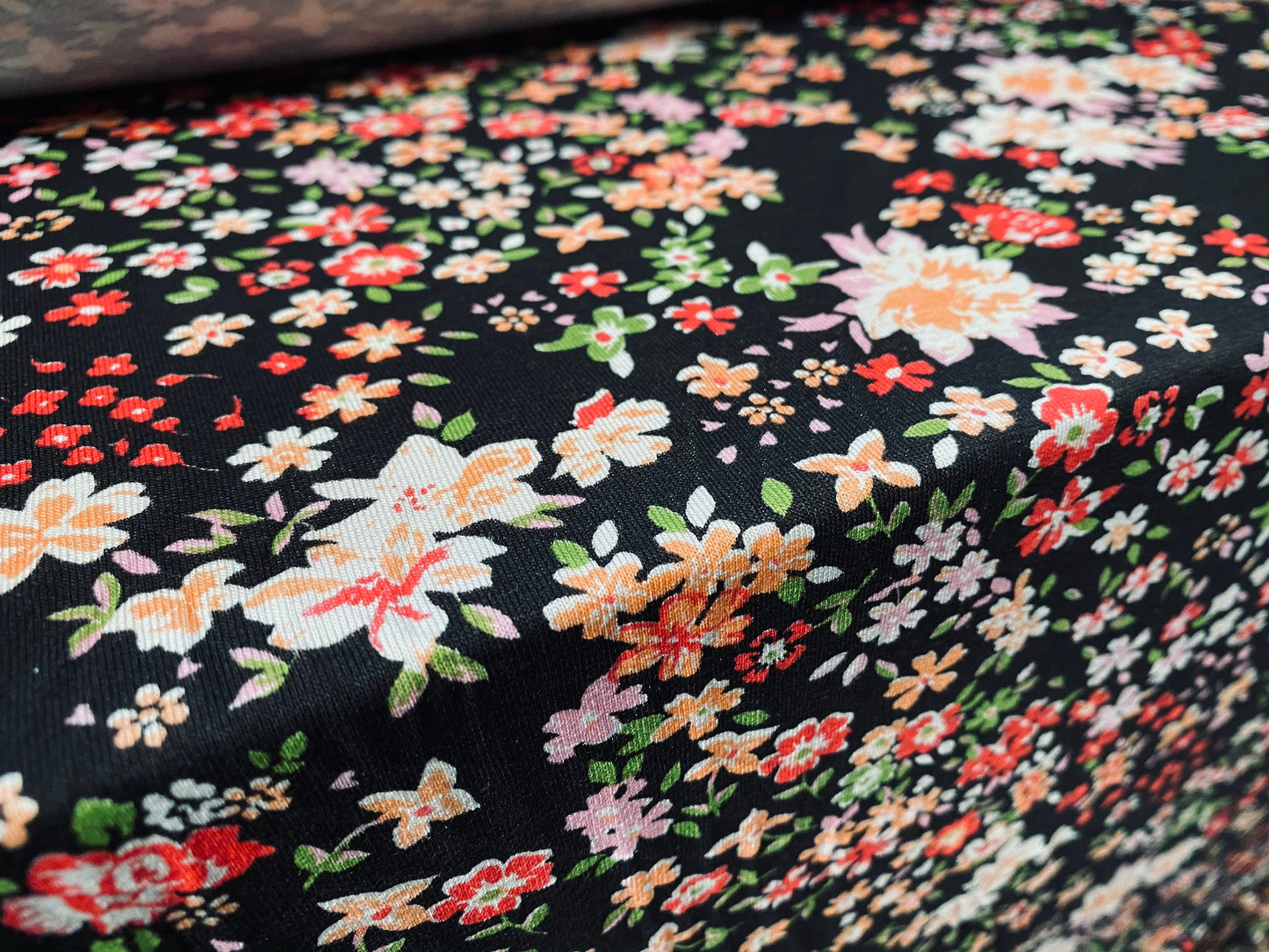 Viscose Elastane stretch jersey fabric, per metre - black with multicolour small flowers print