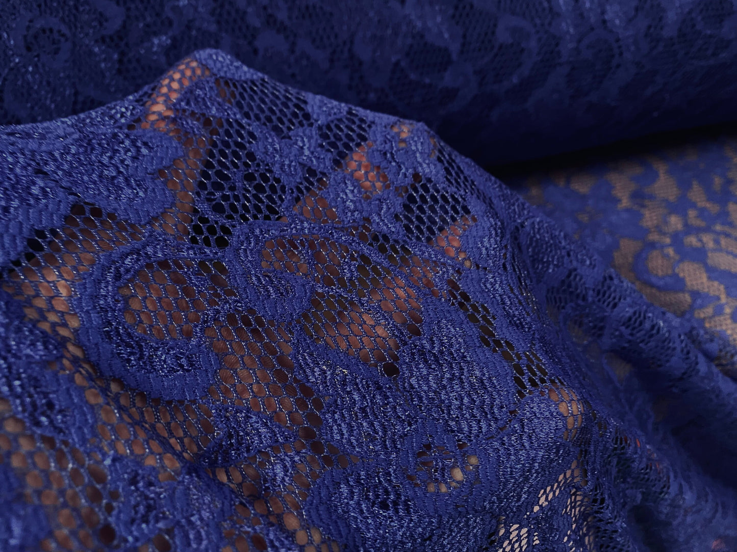 Stretch lace dress fabric, per metre - flower design - royal blue