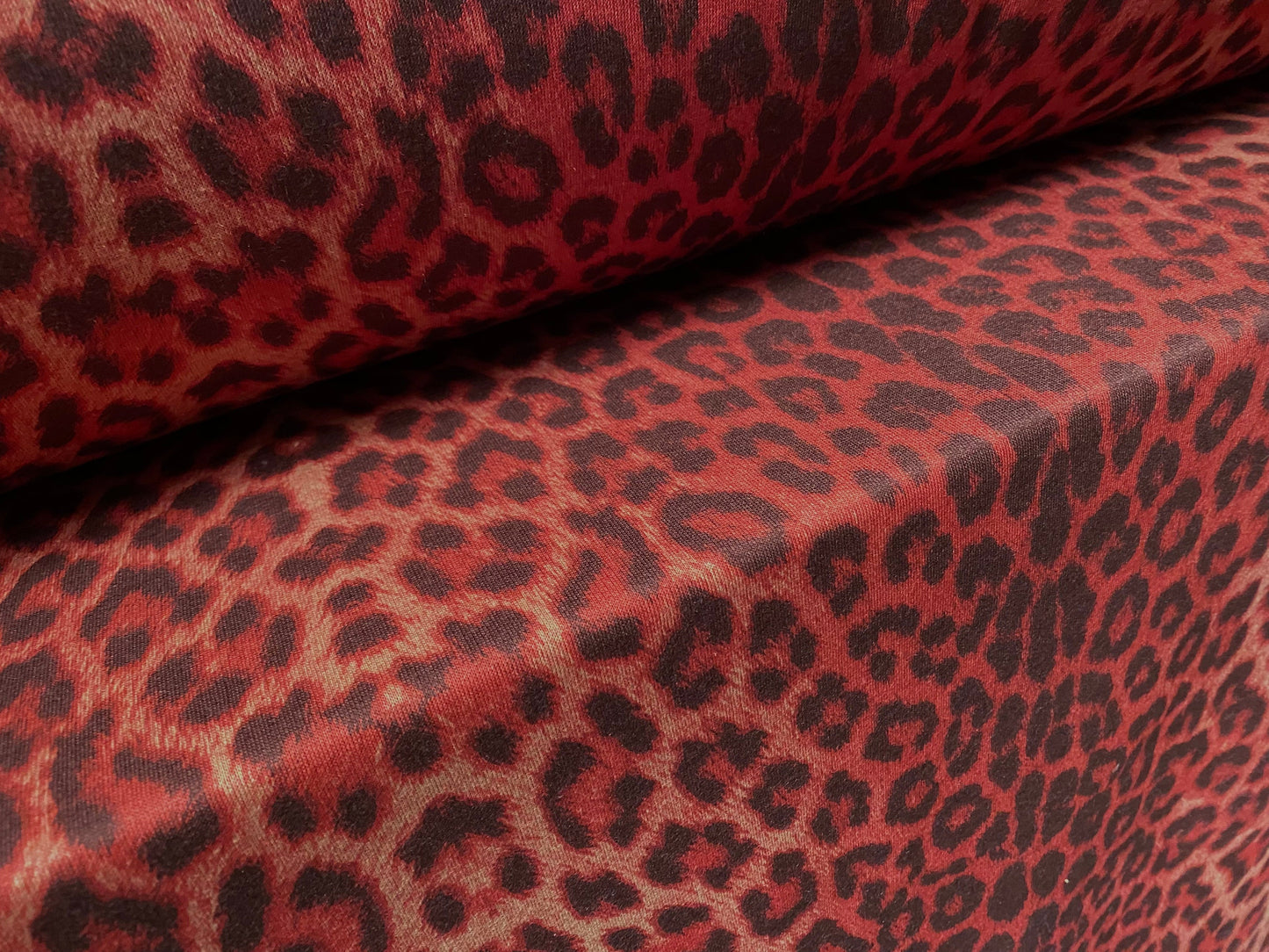 Sweatshirt fleece soft jersey fabric, per metre - Siena brown with red leopardskin animal print