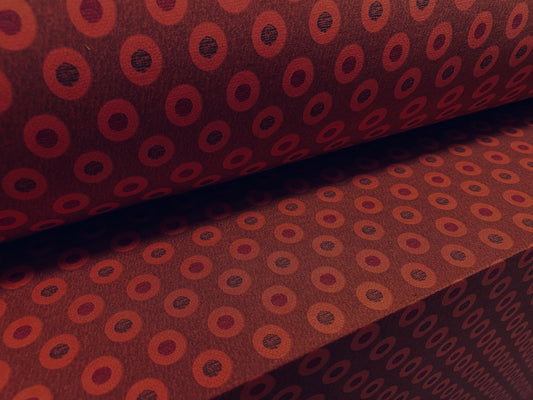 Disco shimmer stretch jersey fabric, per metre - circles print - burnt Orange