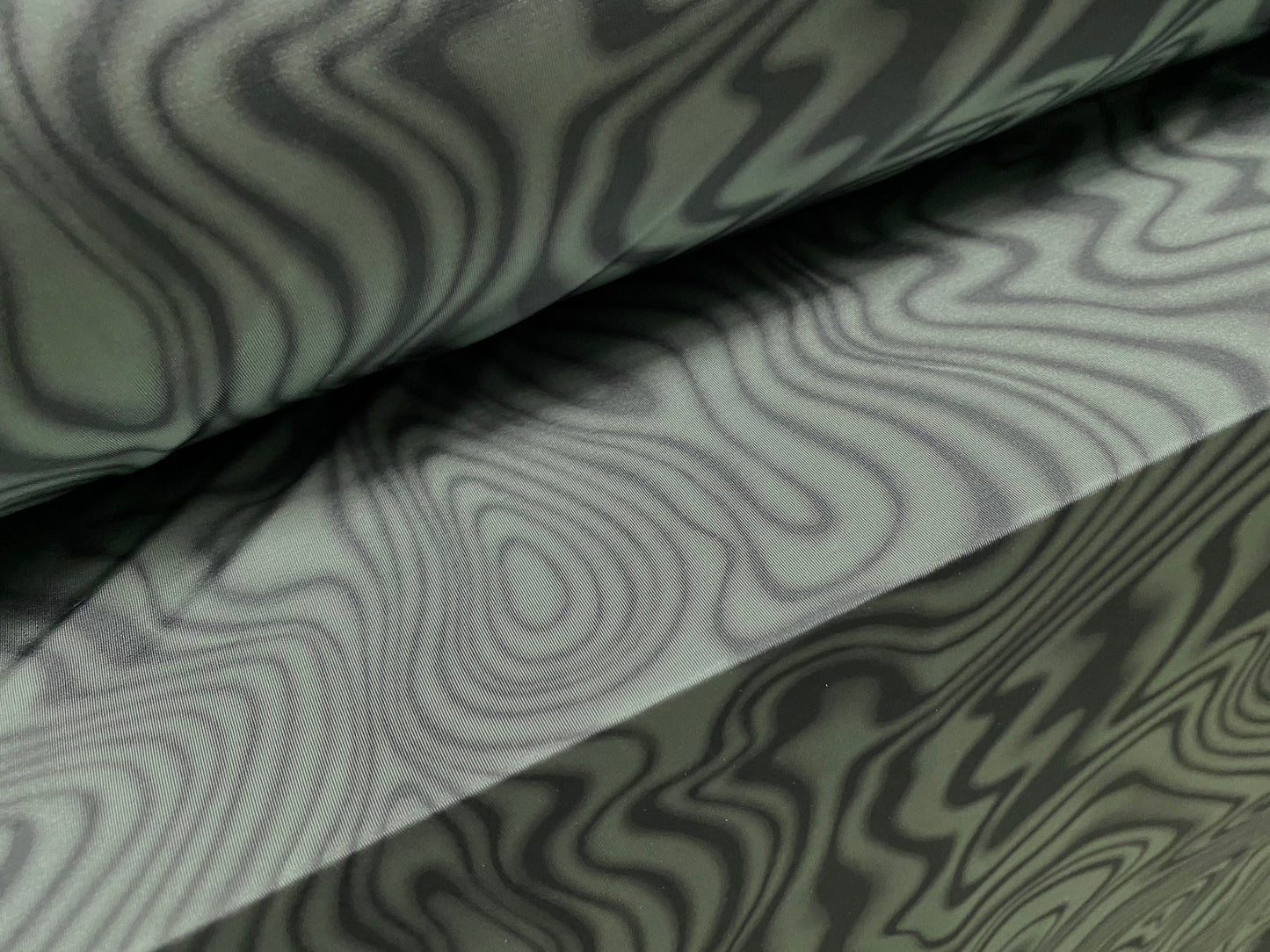 Disco shimmer stretch jersey fabric, per metre - swirl print - sage & olive green