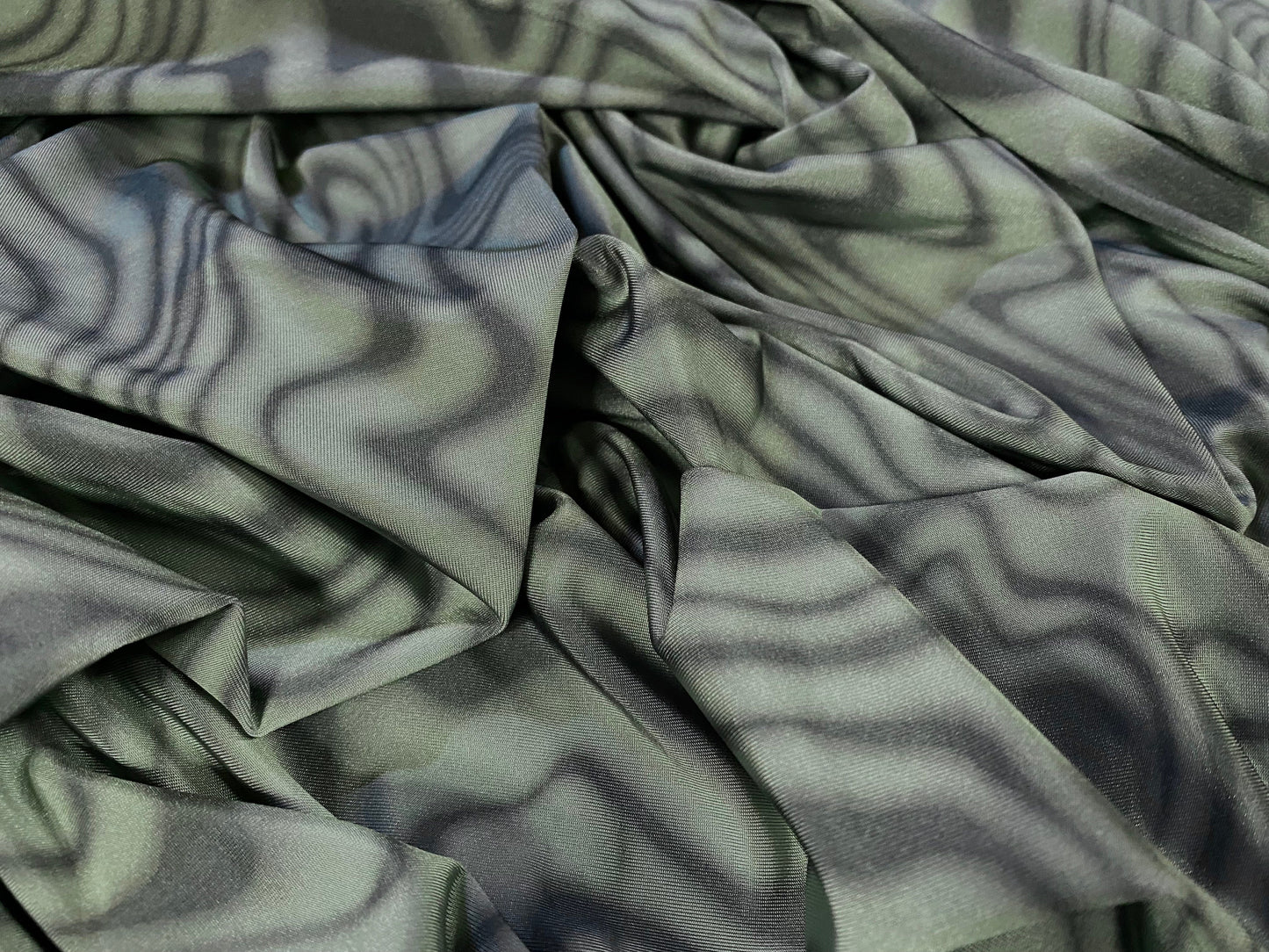 Disco shimmer stretch jersey fabric, per metre - swirl print - sage & olive green