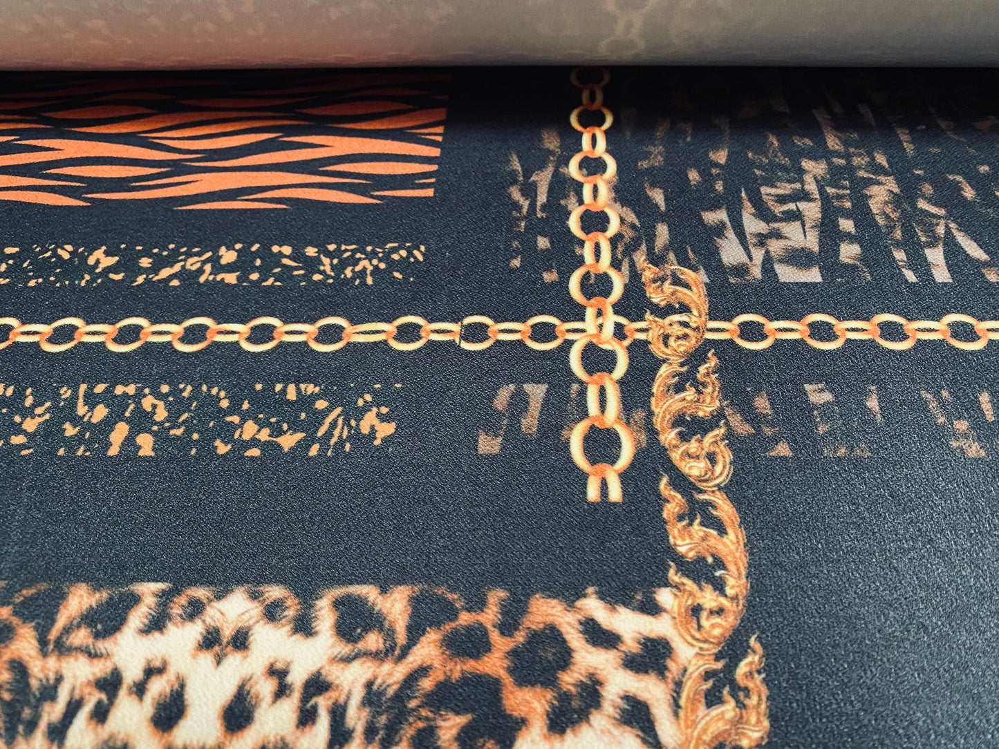 Scuba crepe fabric stretch spandex jersey, per metre - Designer chains and animal print - black & gold