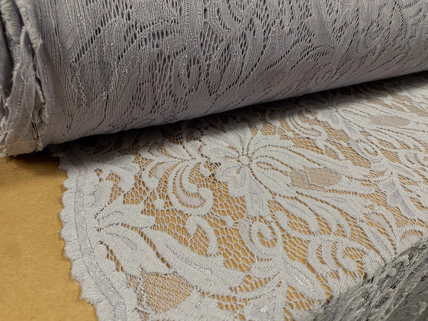 Soft handle stretch lace dress fabric with scalloped selvedge, per metre - grey