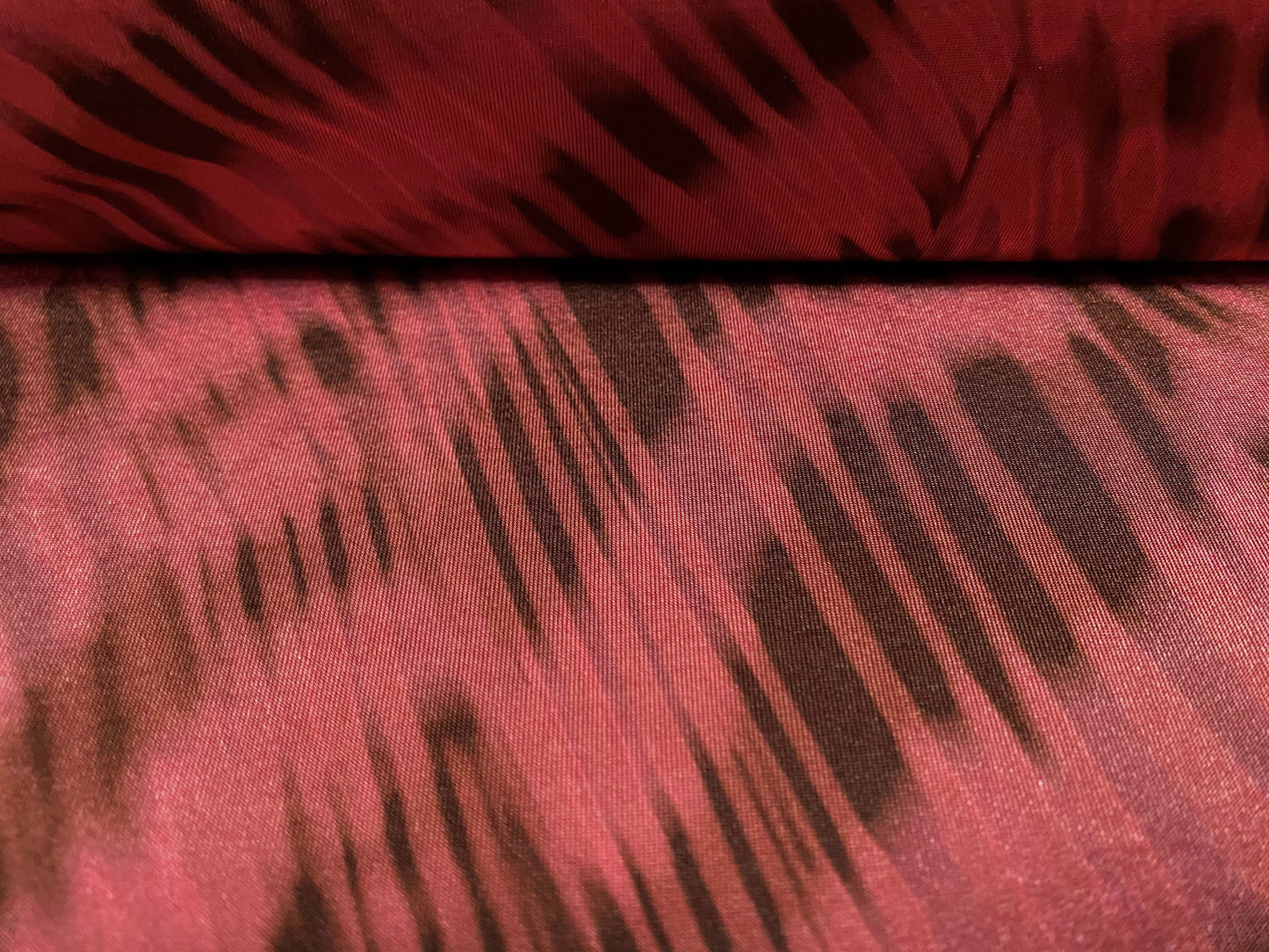 Disco shimmer stretch jersey fabric, per metre - stylised animal print - fuschia