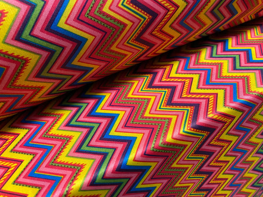 Single jersey polyester fabric - 60 inches wide - tutti frutti zigzag print - yellow & pink