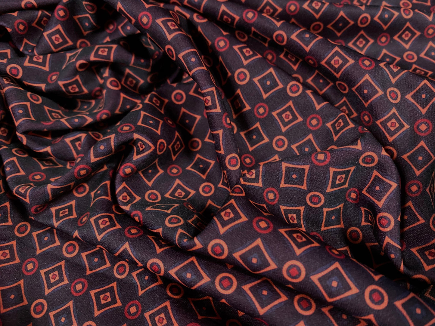 Single jersey polyester fabric - 60 inches wide - Geometric diamonds and circles print - dark purple cerise pink