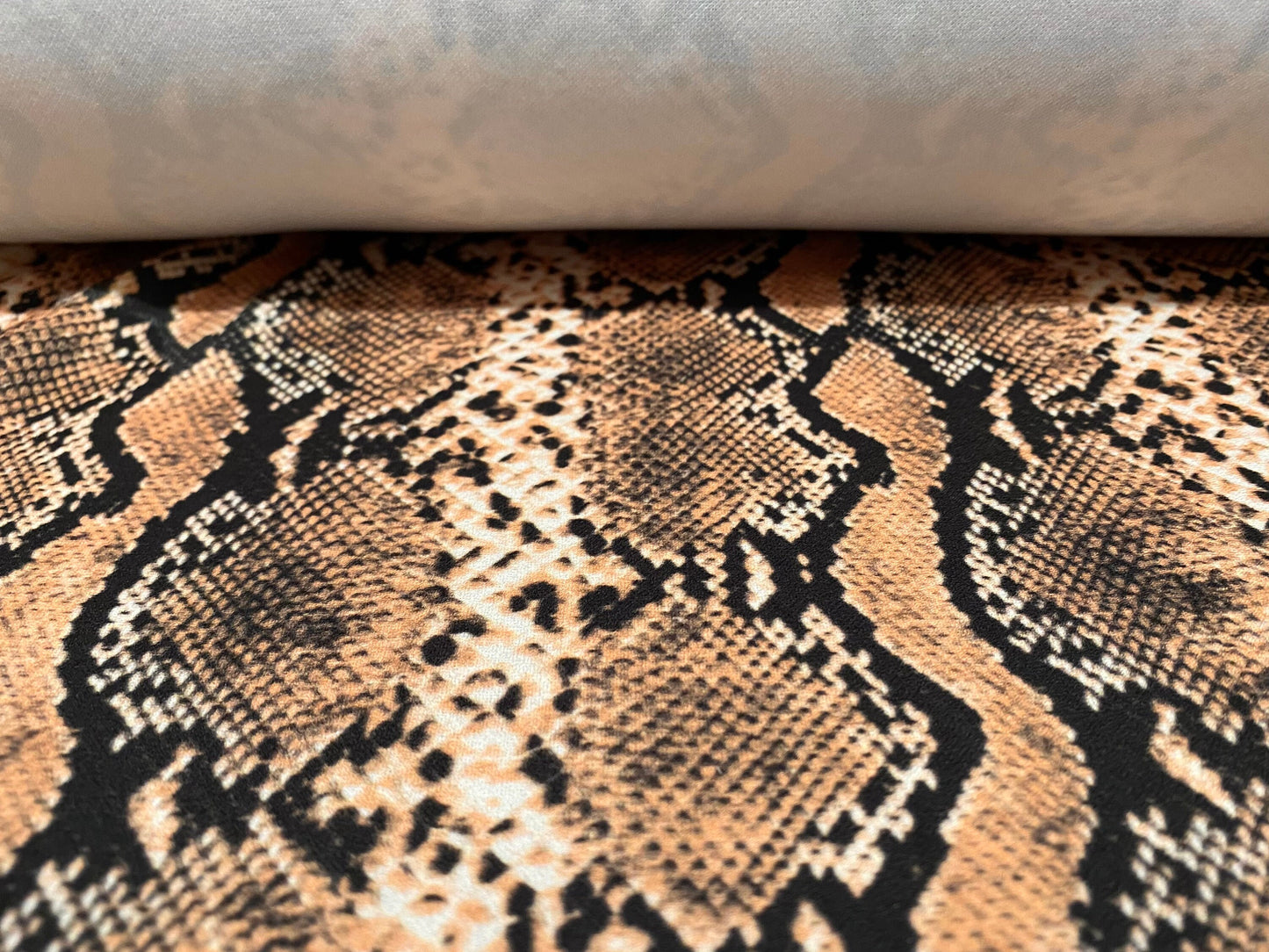 Scuba crepe fabric stretch spandex jersey, per metre - snakeskin animal print - dusky peach & black