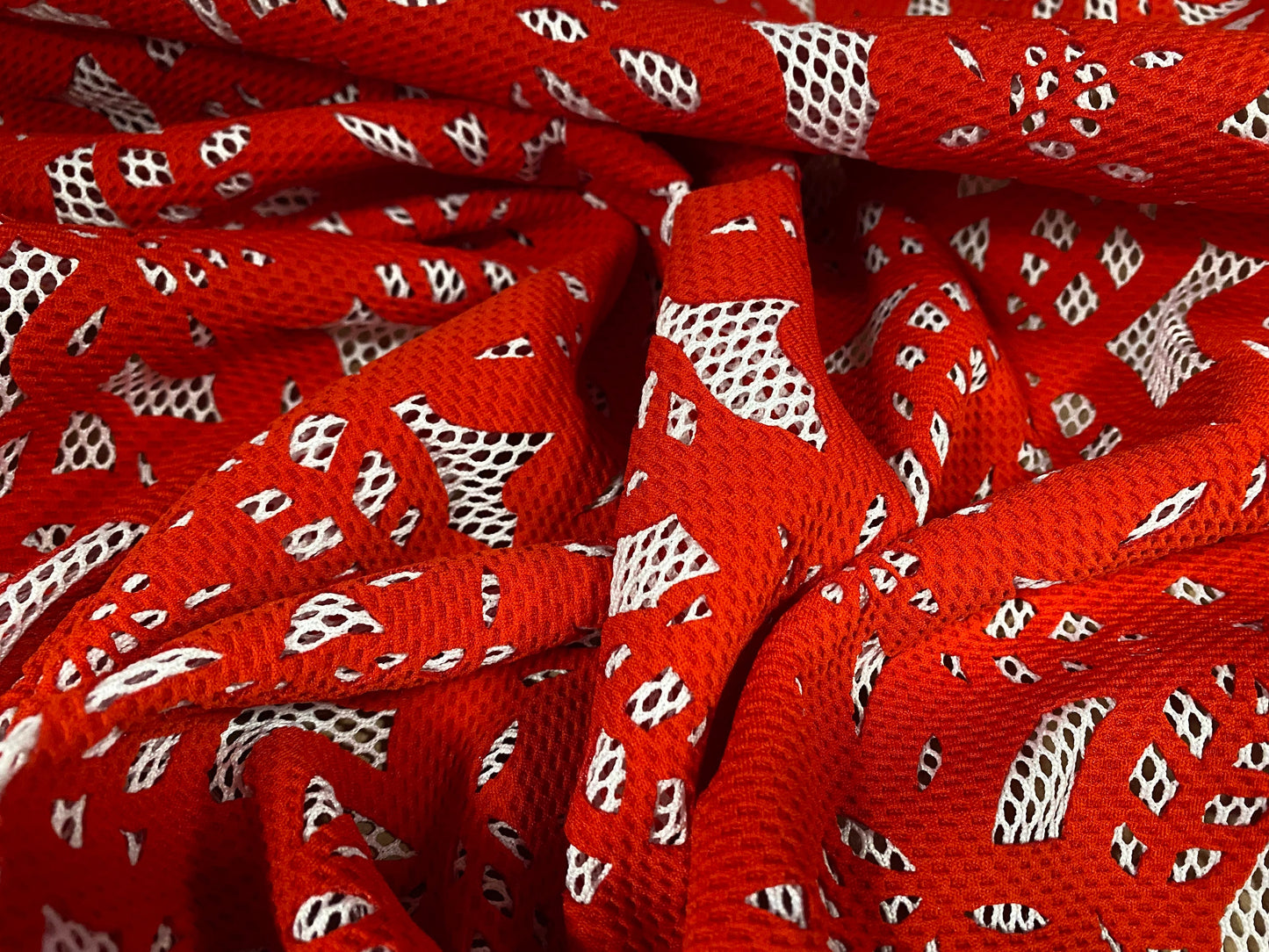 Fishnet fabric with bonded floral overlay, per metre - flower design - red on white