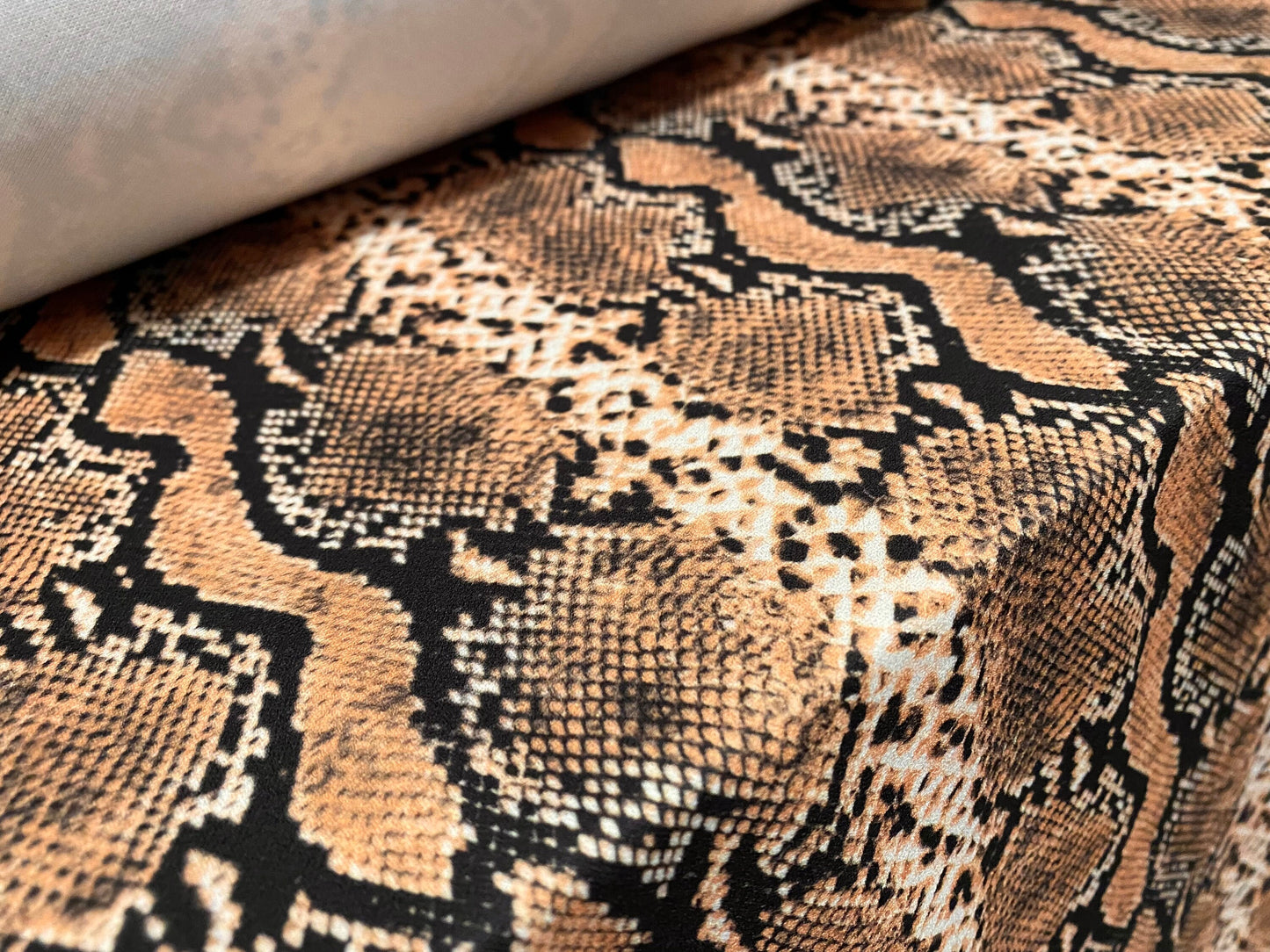 Scuba crepe fabric stretch spandex jersey, per metre - snakeskin animal print - dusky peach & black