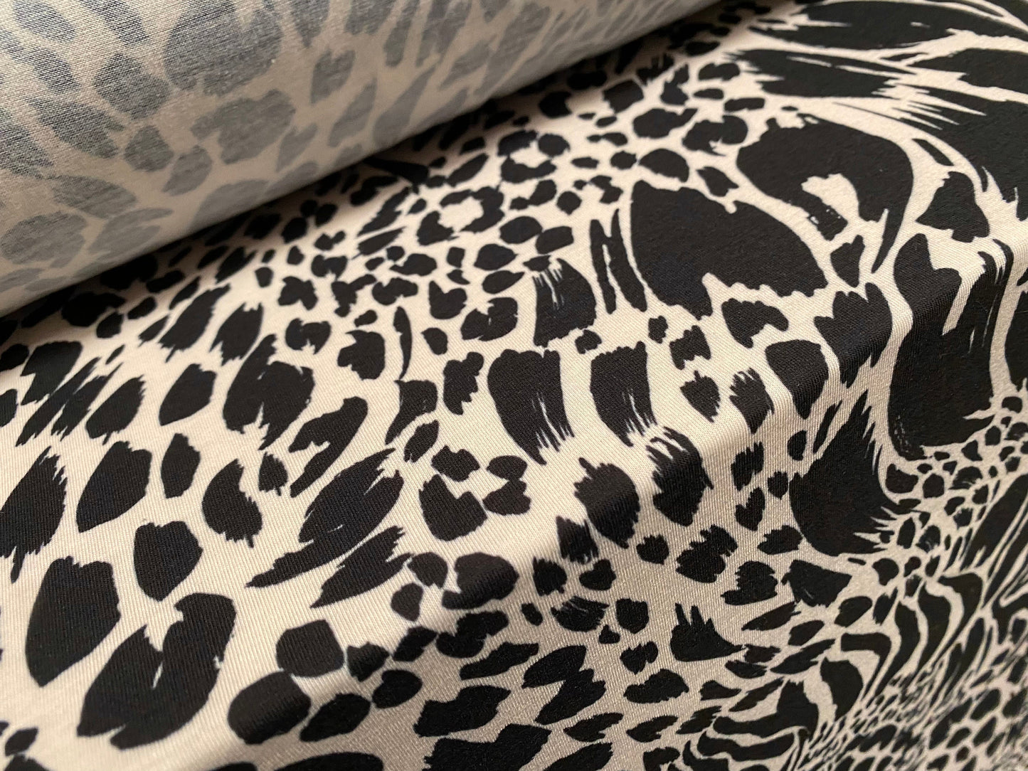 Soft handle stretch jersey fabric, per metre - leopard zebra fusion print - Cream & black