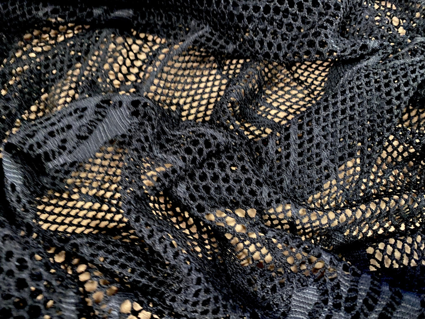 Fishnet 4 way stretch jersey fabric with floral design, per metre - black