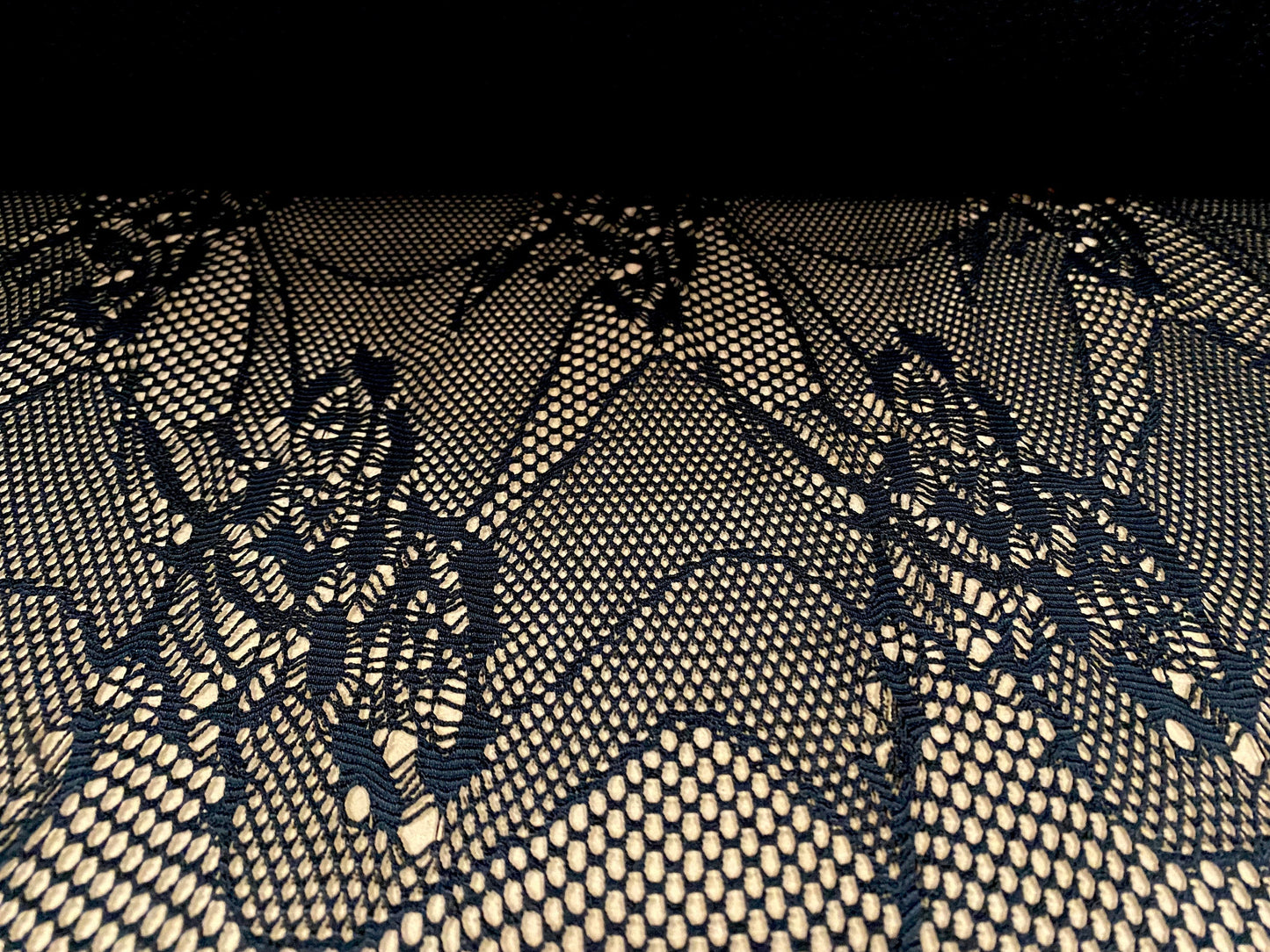 Fishnet 4 way stretch jersey fabric with floral design, per metre - black